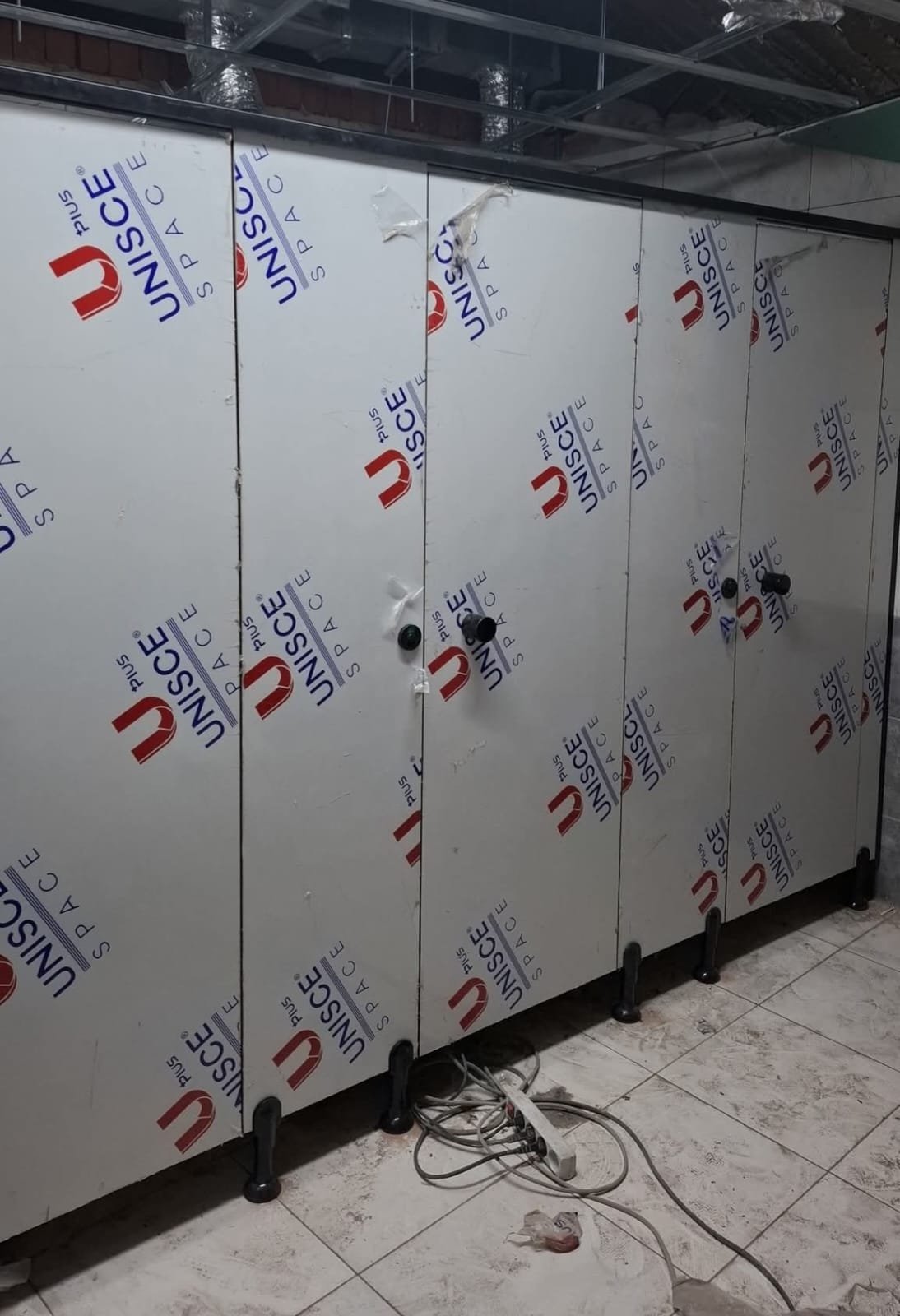 UNISCE compact HPL panel detail on a washroom project in Badr City