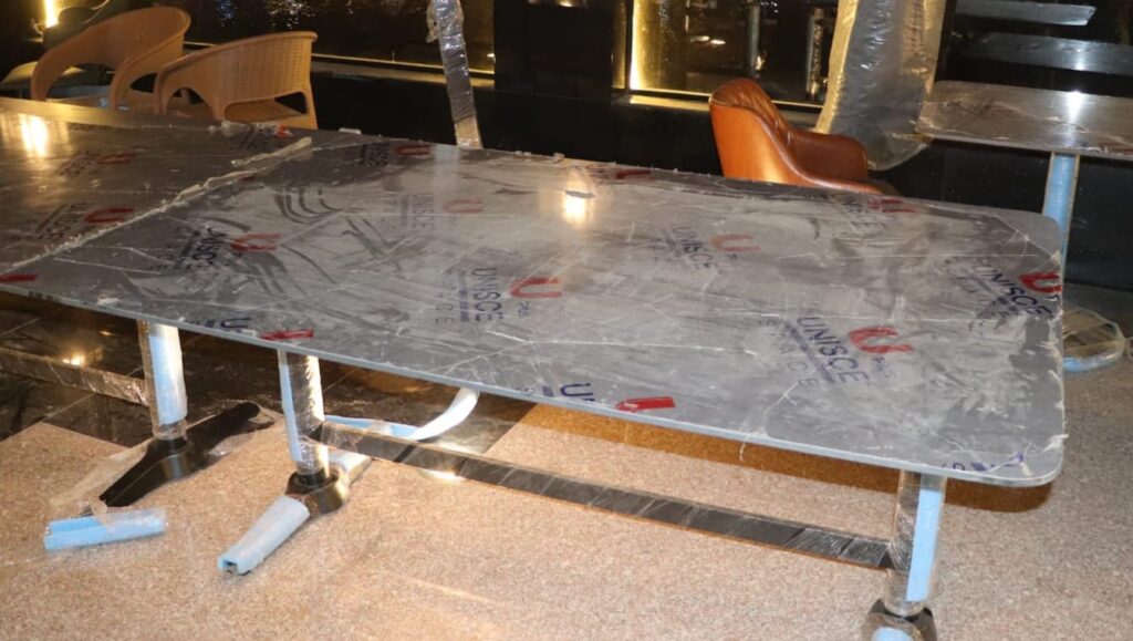 Curved Corian reception desk fabrication for corporate office lobby in Nasr City
