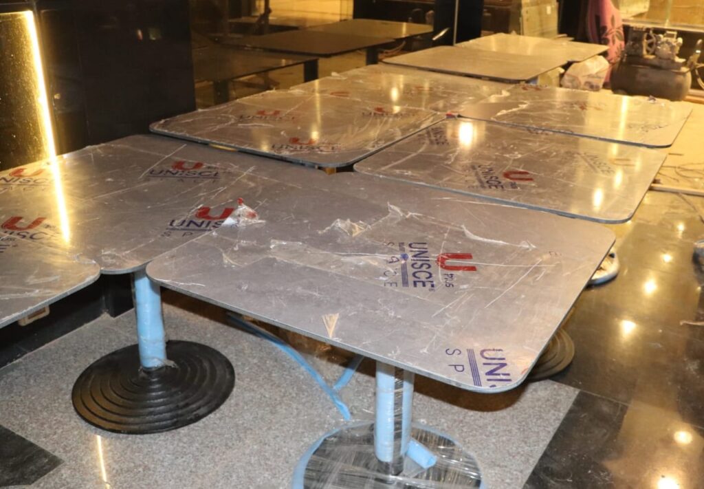 Commercial table surface panels prepared by Cairo House كايرو هاوس in Cairo, showing custom material work from a Corian supplier Cairo and construction materials supplier Cairo businesses can work with.