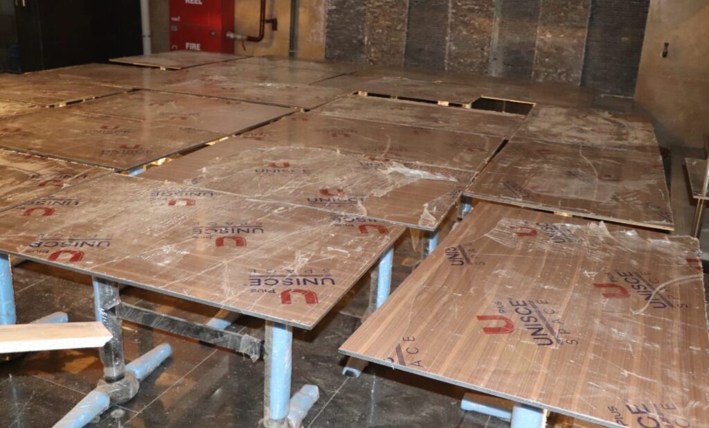 Continuous solid surface bathroom finish with no grout lines, commercial fit-out Cairo