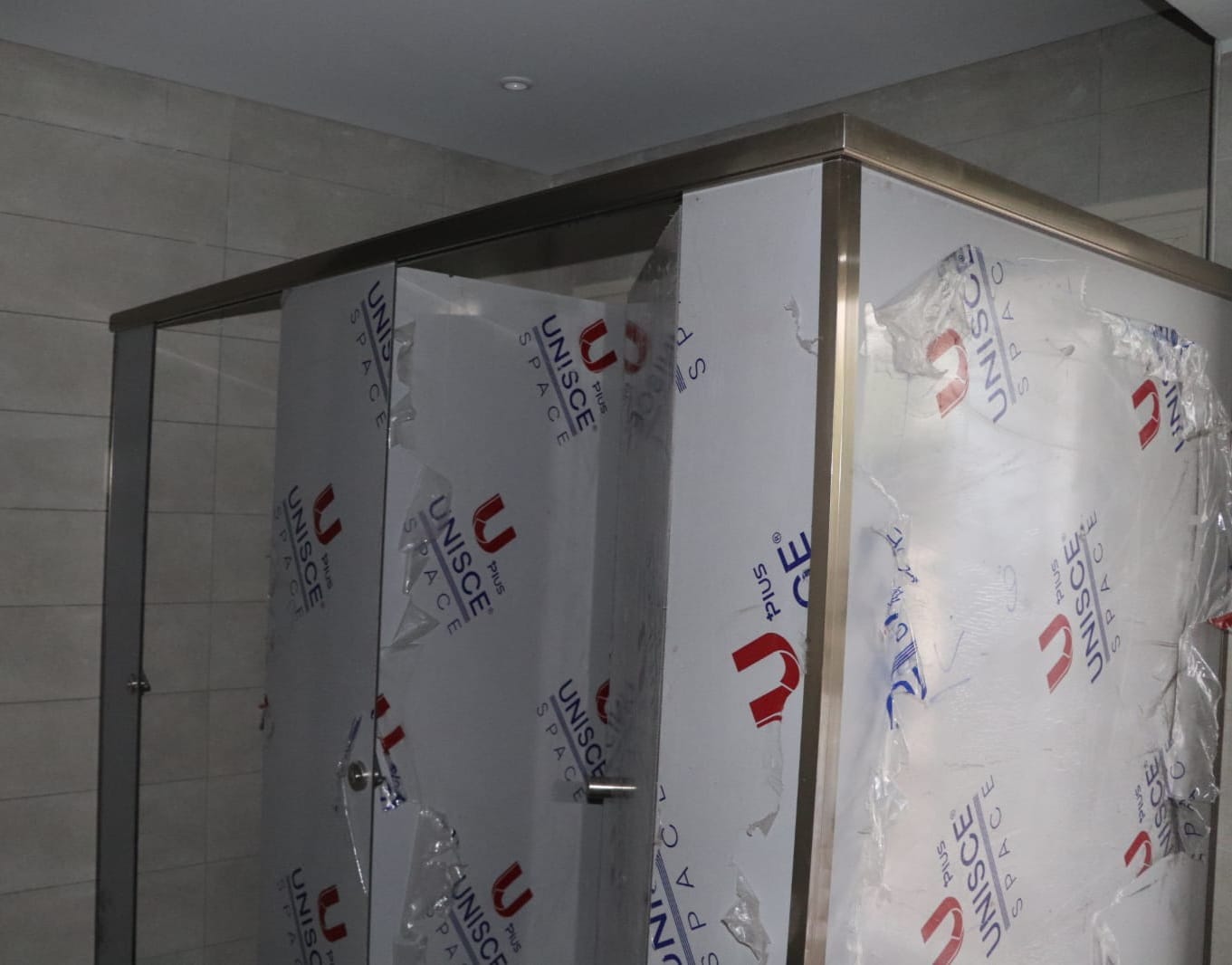 HPL compact bathroom partition project by Cairo House كايرو هاوس, showing installed cabins and metal framing from a construction materials supplier Cairo companies use for durable restroom solutions.