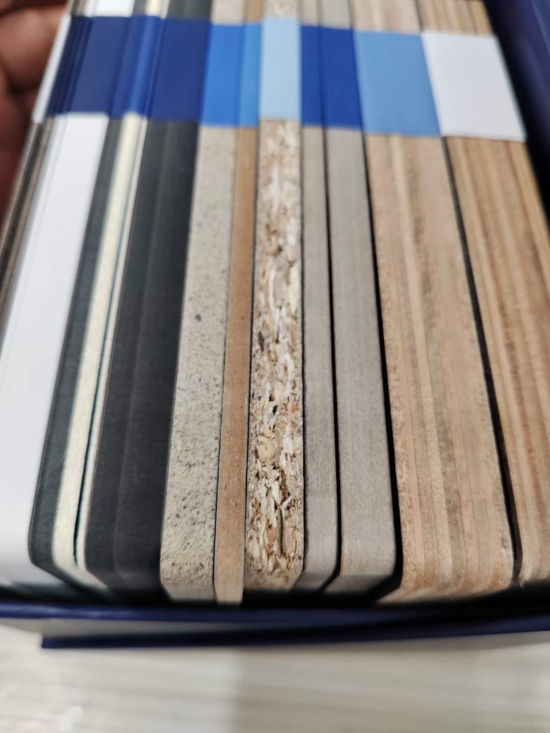 Close view of compact HPL board edges showing the solid kraft core and decorative surface at Cairo House in New Nozha, Cairo. The cross section shows why Compact HPL in Cairo stays rigid and durable for cladding, partitions and furniture.