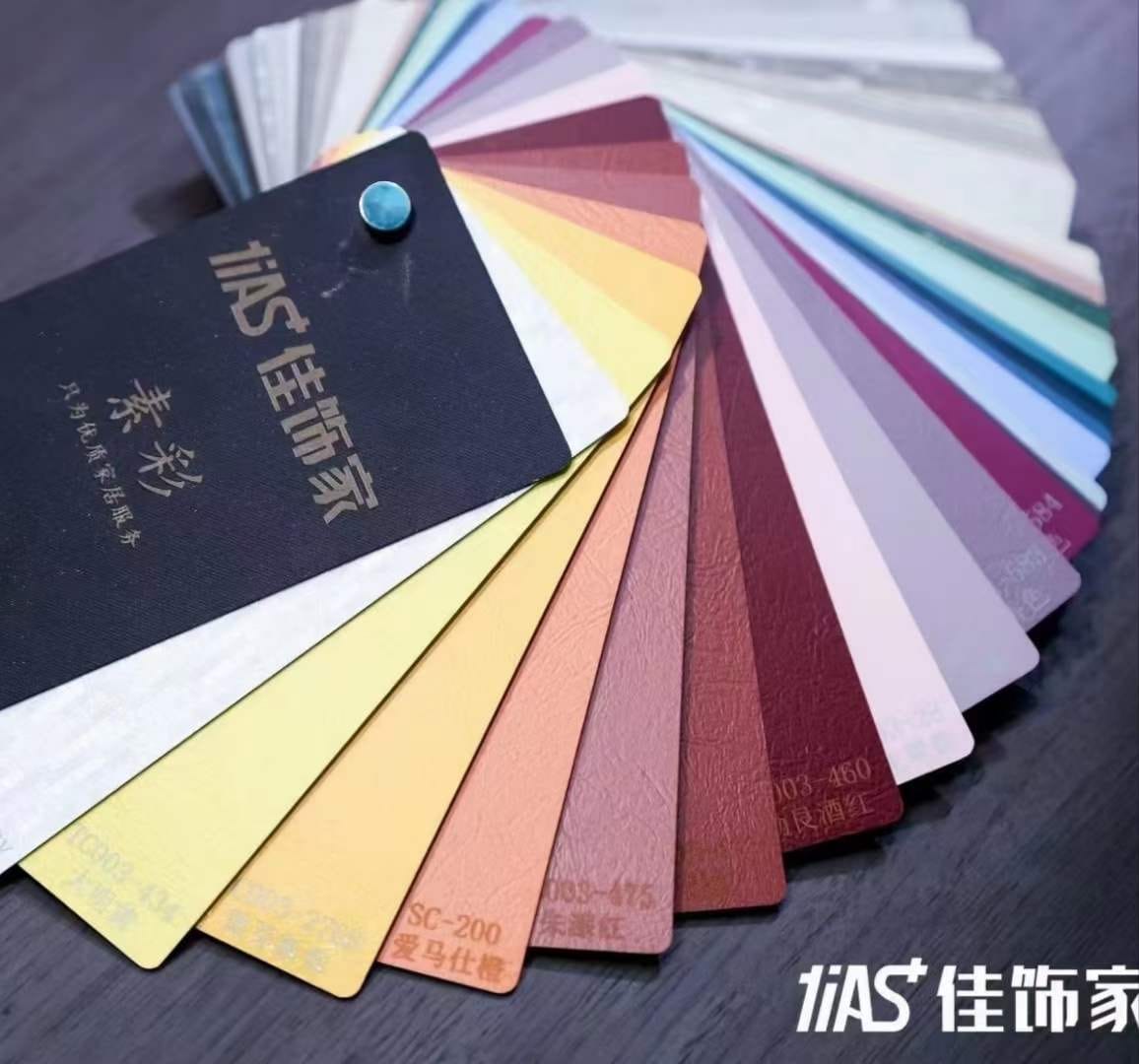 Compact HPL colour swatch fan spread open at Cairo House in New Nozha, Cairo, showing solid shades from yellow to deep red and grey. Clients choosing Compact HPL in Cairo use this fan to match panel finishes for interior fit out projects.