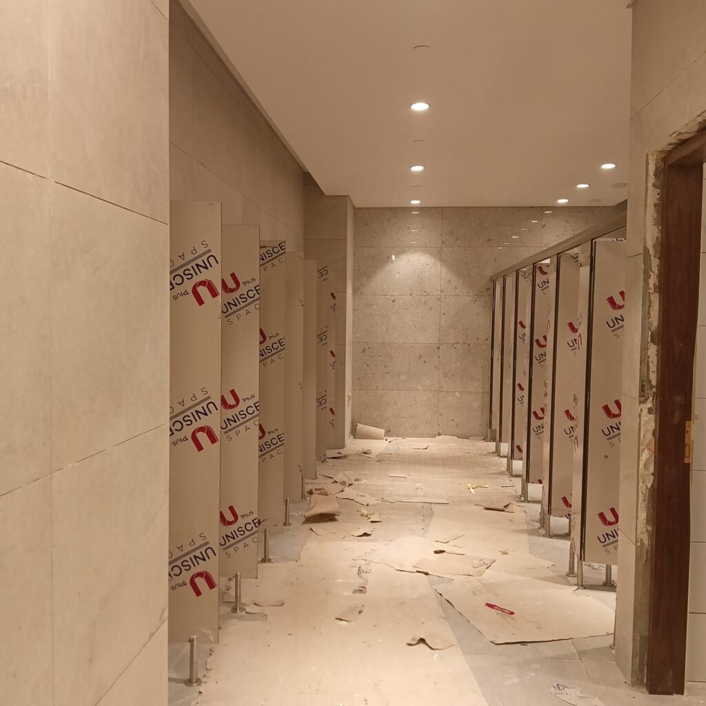 Sand tone compact HPL washroom by Cairo House