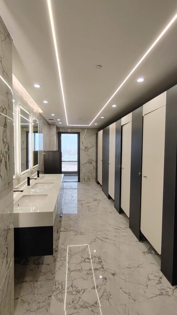 Finished compact HPL washroom with marble by Cairo House