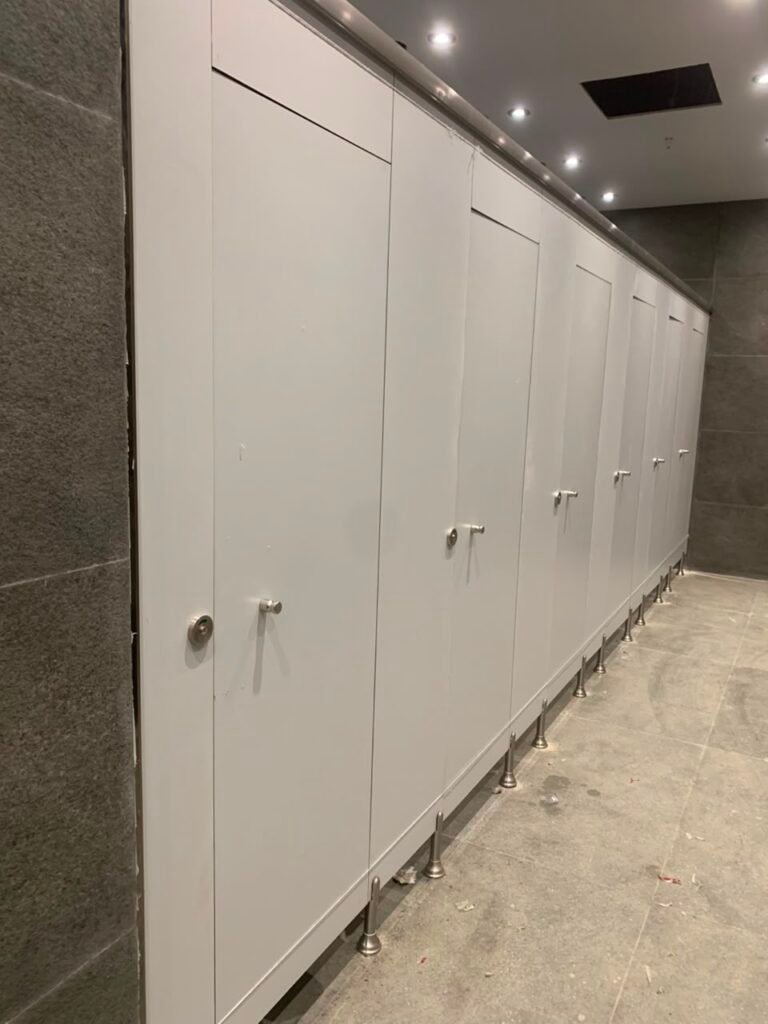 Grey compact HPL cubicles on a granite floor, Cairo House project