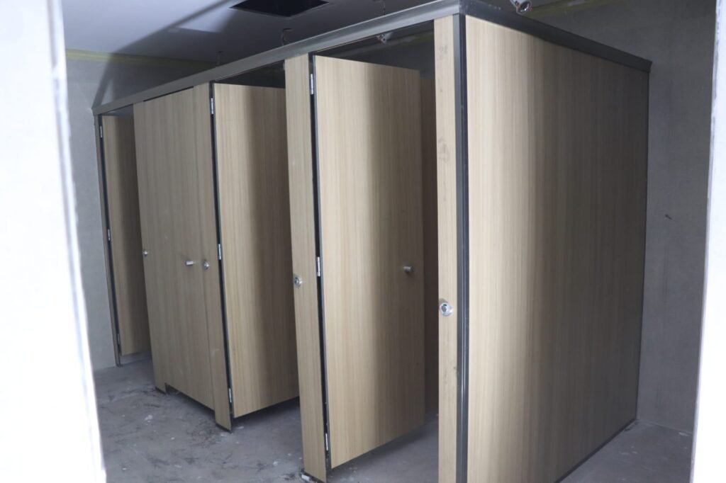 Wood grain HPL toilet cubicles by Cairo House