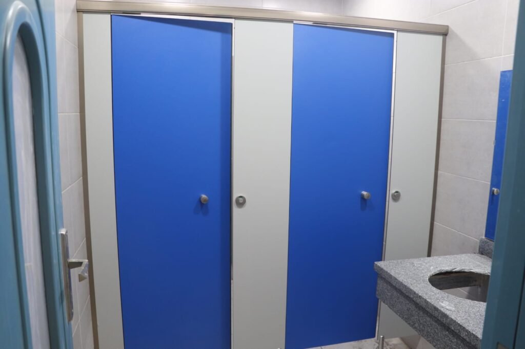 Blue and white partitions in a Cairo House washroom