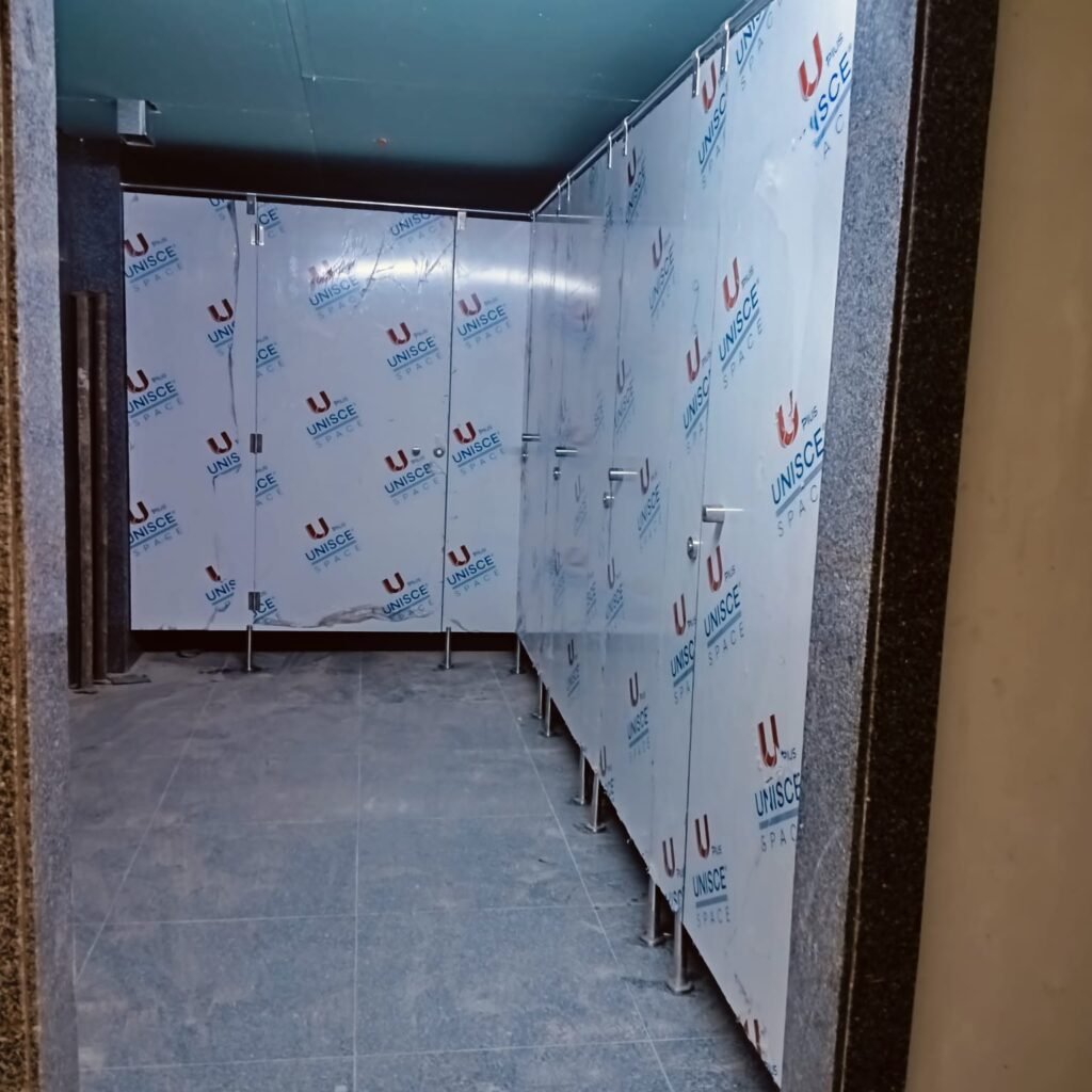 Corridor of blue compact HPL cubicles in a Cairo House project